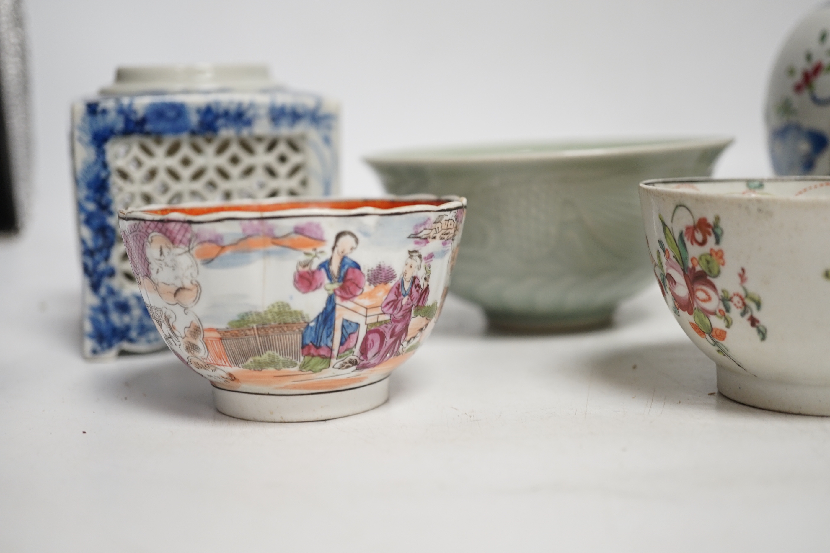 A collection of Chinese ceramics including celadon bowl decorated in low relief with fish, famille rose tea bowls and a jar, largest 12cm high